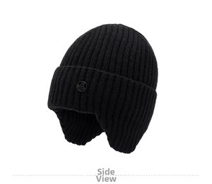 Detail view of the black knit earflap hat showing thick wool texture and logo