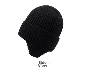Detail view of black knit beanie featuring thick ribbed texture and ear protection