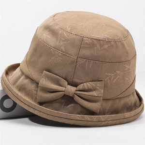 Women's vintage floral bucket hat in brown with a large decorative bow and rolled brim