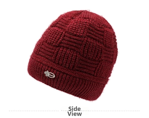 Side view of wine red cable knit beanie with fleece lining and rhinestone flower detail