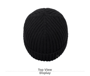 Top view of black ribbed knit beanie with soft fleece lining and metal button detail