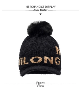 Detail of black chenille knit hat with khaki JILONG embroidery and faux fur pom-pom