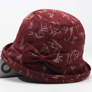 Deep red floral print bucket hat for elderly women with decorative side bow detail