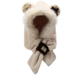 Detail of beige faux fur hooded scarf with cute bear ears and branded fabric label