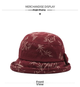 Front view of burgundy floral fisherman hat with golden butterfly patterns for women