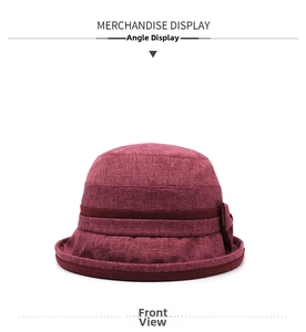 Dettaglio del cappello da sole bordeaux con fiocco e tessuto a trama fitta