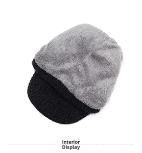 Close-up of winter knit hat showing thick gray fleece lining for cold protection
