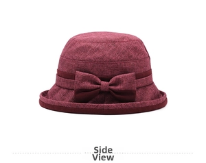 Dettaglio cappello parasole bordeaux con trama in lino e fiocco decorativo laterale