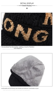 Detail view of winter chenille knit hat featuring warm fleece lining and embroidered letters