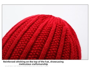 Close-up of reinforced top stitching on red winter knit hat for elderly women