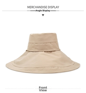 Detailed front view of wide brim beige bucket hat with parallel stitching and tie strap