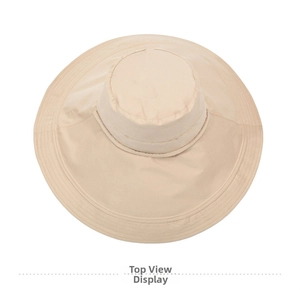 Top view of beige wide-brimmed sun hat showing canvas texture and reinforced stitching