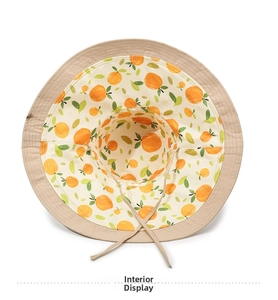Detail view of khaki sun hat lining with orange fruit pattern and adjustable wind strap