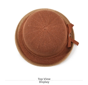 Top view of caramel brown breathable knit bucket hat with elegant bow detailing