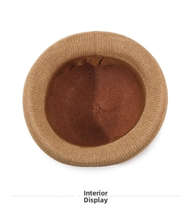 Detail view showing the breathable weave and interior lining of the camel sun hat