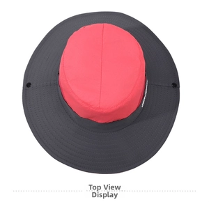 Detail of red and grey sun hat with wide brim, reinforced stitching and quick-dry fabric