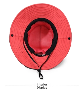 Detail of red sun hat featuring breathable mesh lining and adjustable chin strap