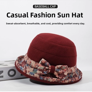 Close-up of winter cloche hat with floral fabric trim and bow detail for elderly women