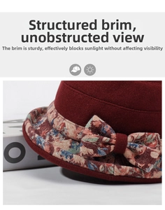Close-up of wine red wool hat brim showing floral ribbon and stylish bow detail