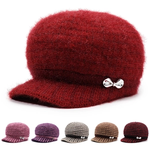 Detailed close-up of winter knit newsboy hats showing fleece lining and multiple color options
