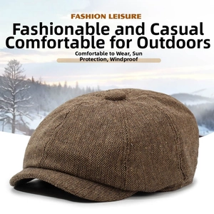 Detail view of brown newsboy cap showing tweed texture and sun protection features