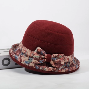 Deep red winter bucket hat for elderly women with floral brim and bow detail