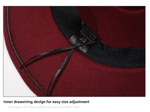 Detail view of burgundy fedora hat interior with adjustable drawstring and 57 size label