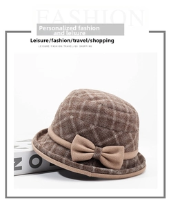 Detail of dark brown plaid wool cloche hat with an elegant decorative side bow tie