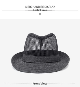 Macro detail of breathable hollow mesh weave and ribbon trim on black summer fedora hat