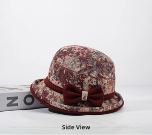 Detail of floral bucket hat with burgundy bow for middle-aged women in autumn and winter