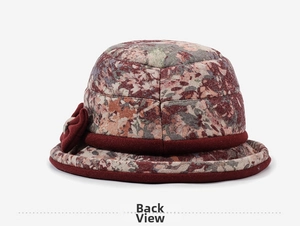 Rear view of elderly women's cloche hat with floral patterns and a velvet bow