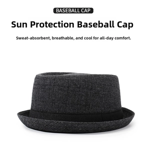 Detail of grey plaid fedora hat with a black satin ribbon and thick textured fabric