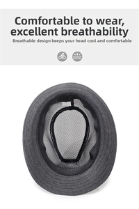 Close-up of breathable mesh lining inside a dark grey summer woven fedora hat
