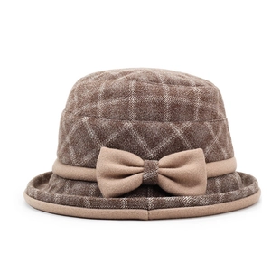 Close-up of brown plaid wool bucket hat featuring a decorative 3D bow detail for winter