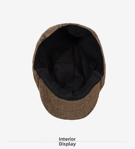 Detail view of cotton linen newsboy cap lining with elastic edge and leather buckle decoration