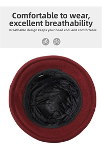 Detailed view of the warm black quilted lining inside the burgundy winter bucket hat