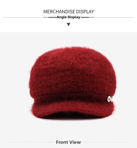 Close-up of wine red knit hat for women featuring a plush texture and silver bow detail