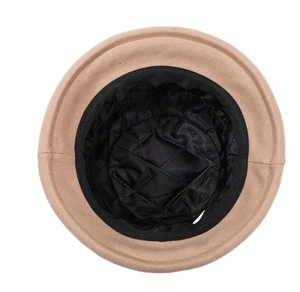 Detail view of khaki wool felt hat featuring black quilted lining and ribbed sweatband