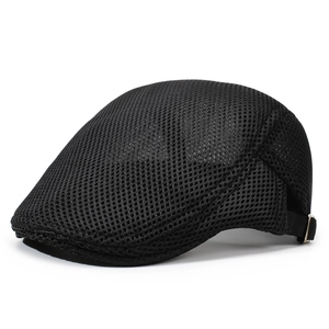 Close-up of black mesh sun hat with adjustable metal buckle and breathable honeycomb texture
