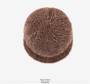 Top view of a thick dark brown plush knit winter hat for elderly women with soft texture