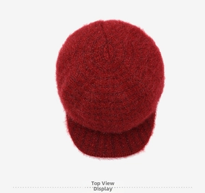 Detailed top view of a dark red winter knit hat for elderly women with warm fleece lining