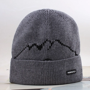 Winter thermal grey knit beanie with mountain pattern and decorative woven label