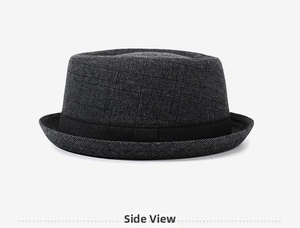 Side view of dark gray plaid fedora hat featuring textured fabric and black matte ribbon