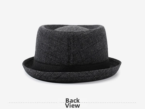 Detailed back view of a dark grey plaid fedora hat with textured weave and black ribbon