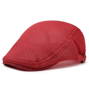 Detail of red mesh ivy cap showing breathable honeycomb fabric and metal buckle