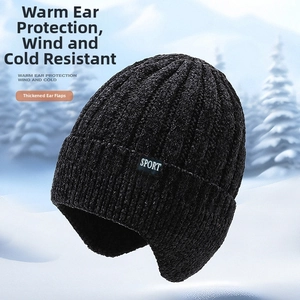 Detailed texture of thick black chenille winter hat with SPORT label and fleece lining