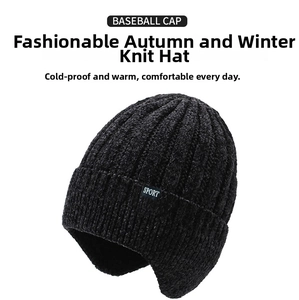 Detail view of thick black chenille knit texture and earflap design on men's winter hat