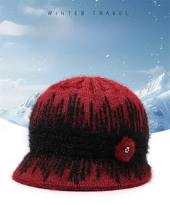 Detail of red and black knit bucket hat for women with thick velvet lining and rhinestones