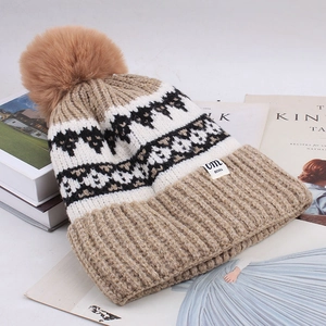 Diamond pattern knit beanie with fluffy pom pom and wide ribbed cuff in earthy tones