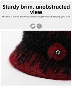 Detail of red and black knit hat with shimmering thread and rhinestone decoration